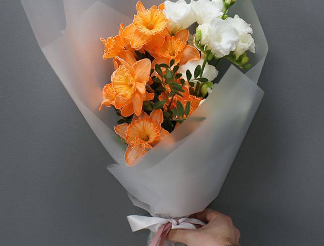 Bouquet with orange daffodils and white freesia photo